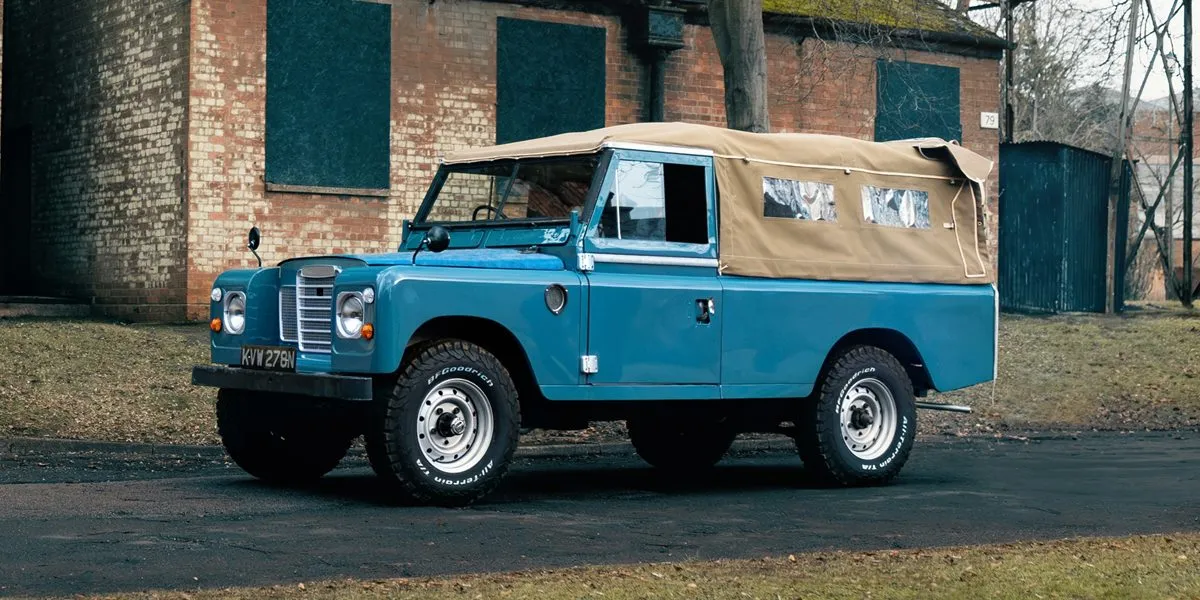 Blue Land Rover Series pick up with canvas back