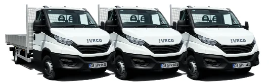 Three Iveco Daily dropside trucks